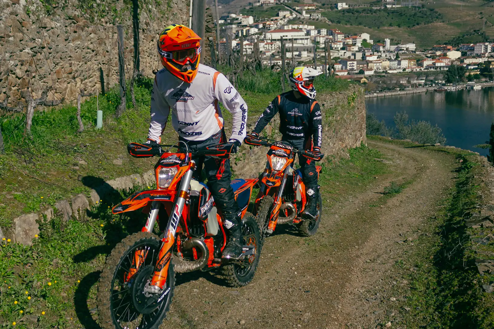 KTM dirt bike rider on a rocky trail in Portugal