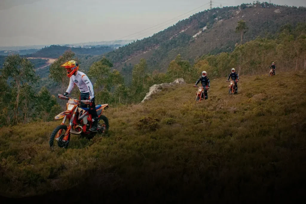 Enduro riders exploring mountain trails in Portugal