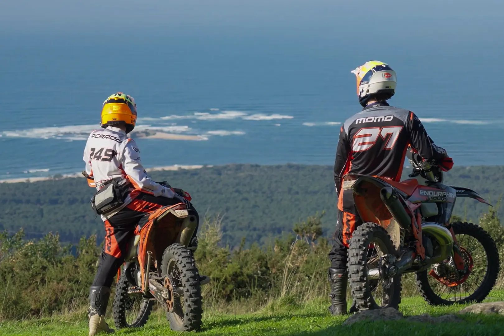 Enduro riders overlooking the Atlantic coast in Portugal